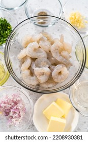 Measured Ingredients In Glass Mixing Bowls To Make Shrimp Scampi With Linguine Pasta.