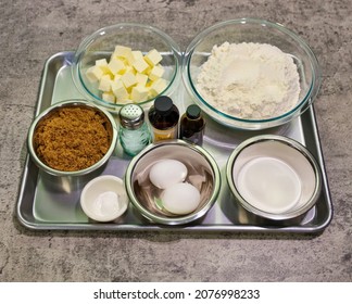 Measured Ingredients For Making Sugar Cookies On Top Of A Baking Sheet.