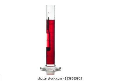 Measurement of alcohol and sugar in a red grape must with an analog winemaking hydrometer. - Powered by Shutterstock