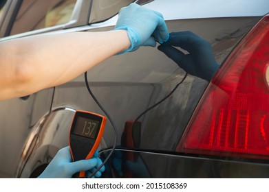 Measurement Of The Thickness Of The Paint On The Car After Painting. Selective Focus.