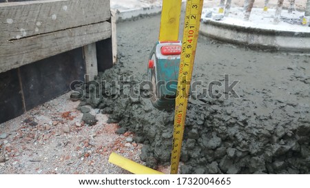 Measuring of blinding concrete height.Quantity taking from construction site.