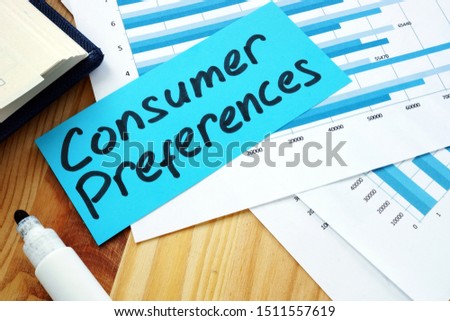 Measuring Consumer Preferences concept. Stack of papers with charts.