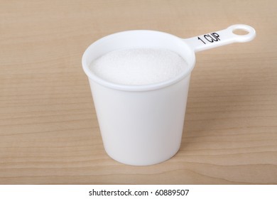 Measuring Cup With One Cup Of Sugar