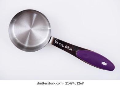 Measuring Cups and Spoons, on a white background. 1⁄4 cup 60mL.
