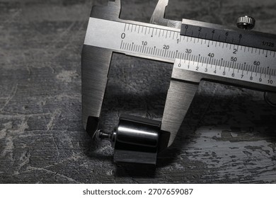 Measuring the height of a laboratory weight using vernier calipers