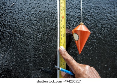 Measuring level with plumb bob