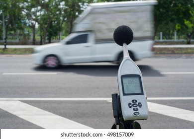 Measuring The Noise Of Cars On The Road With A Sound Level Meter.