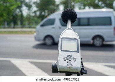 Measuring The Noise Of Cars On The Road With A Sound Level Meter.