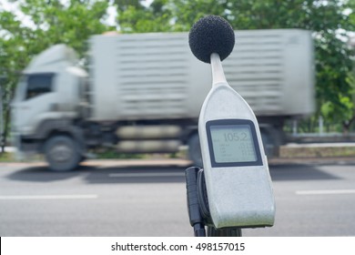 Measuring The Noise Of Cars On The Road With A Sound Level Meter.