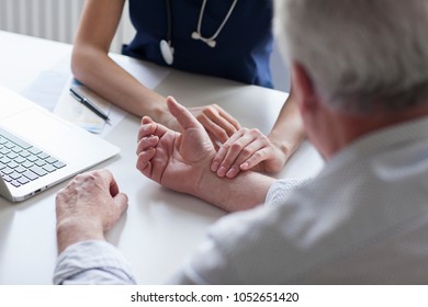 Measuring Of Pulse On Wrist By The Doctor.