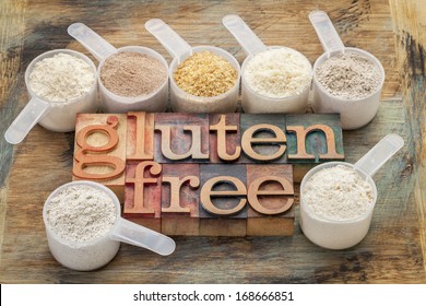 measuring scoops of gluten free flours (almond, coconut, teff, flaxseed meal, whole rice, brown rice, buckwheat) wit a text in letterpress wood type - Shutterstock ID 168666851