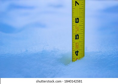 Measuring The Snow Depth With Yellow Ruler 4 Feet