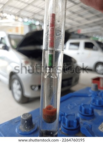 measuring the specific gravity of a car battery