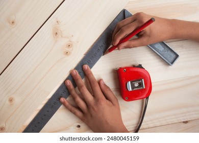 Measuring with a square. A measuring tape. Tools for measuring. Joiner's (carpenter's) workshop. Close-up. - Powered by Shutterstock