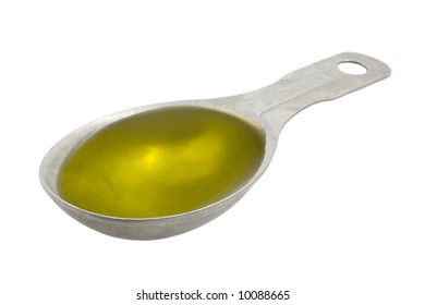 Measuring Tablespoon Of Olive Oil Isolated On White, Clipping Paths Included