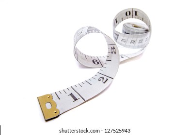 Premium Photo  Measuring tape with centimeters and inches isolated on  white background.