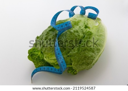 Similar – Image, Stock Photo Fresh leaf salad with a measuring tape on a board