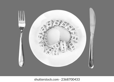 Measuring Tape on a Place Setting  on grey  Transparent  background - Shutterstock ID 2368700433