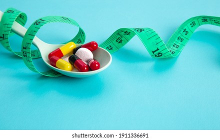 Measuring Tape And Pills For Dieting Concept. EKG Medical Health Care And Prevention.