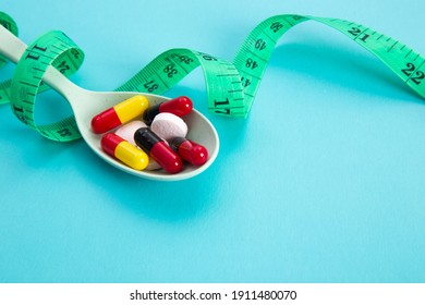 Measuring Tape And Pills For Dieting Concept. EKG Medical Health Care And Prevention.