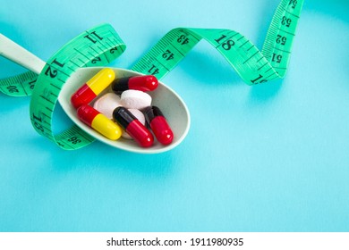 Measuring Tape And Pills For Dieting Concept. EKG Medical Health Care And Prevention.