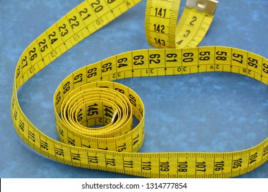 Measuring Tape Unrolled In Different Ways