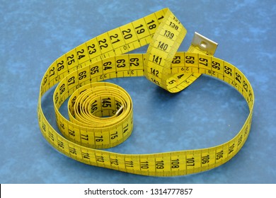 Measuring Tape Unrolled In Different Ways