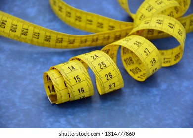 Measuring Tape Unrolled In Different Ways