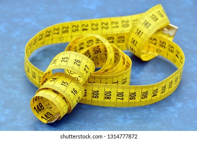 Measuring Tape Unrolled In Different Ways