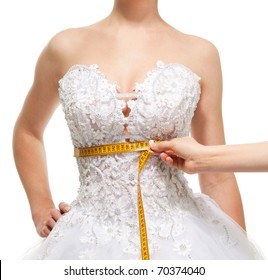 Measuring woman's waist under the breast with centimeter, isolated on white - Powered by Shutterstock