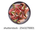 Meat appetizer dried duck breast fillet meat slices, magret smoked poultry isolated on white background. top view.