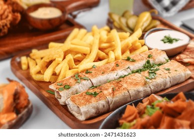 meat beef shawarma arabic meal cute meal with parsley and tahniah and French fries with cheese source , selective focus 