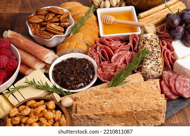 A Meat Cheese And Fruit Charcuterie Board On A Wooden Butcher Block