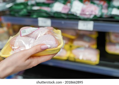 Meat In Food Store . Woman Choosing Packed Fresh Chicken Meat In Supermarket .