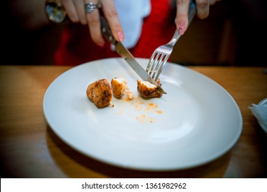meat with a fork and a knife