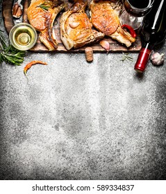 Meat grill. Fried steak of pork with red wine and spices. On rustic background.
