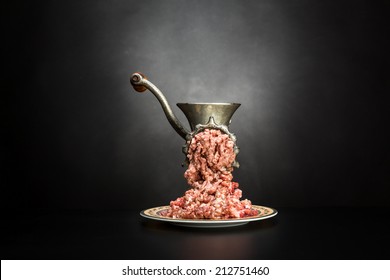 Meat grinder on a black background
