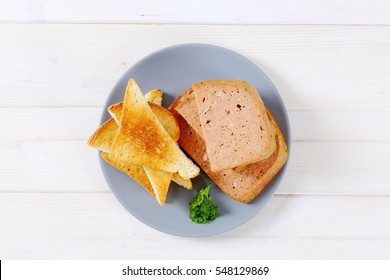 Meat Loaf With Toasts On Grey Plate