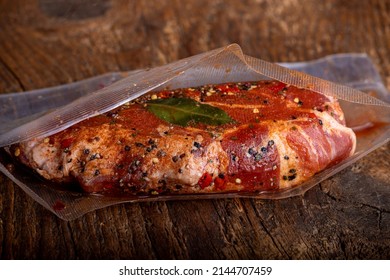 Meat In A Marinade Bag On Wood