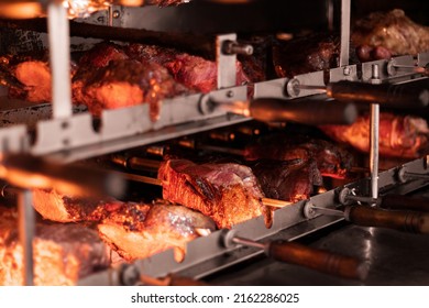 Meat On Skewers On The Grill With Fire And Embers - Brazilian Bbq Restaurant - Picanha