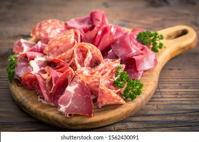 Meat platter with delicious salami, sliced ham, sausage, and bacon 