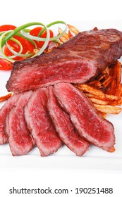 Meat And Potato : Rare Grilled Beef Steak Served With Pepper And Tomato Over Plate Isolated On White Background