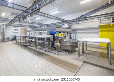 Meat processing machines at meat factory. Cutting meat in slaughterhouse. Beef processing factory. Cattles cut and hanged on hook in slaughterhouse, Meat industry, Wagyu Beef. - Powered by Shutterstock