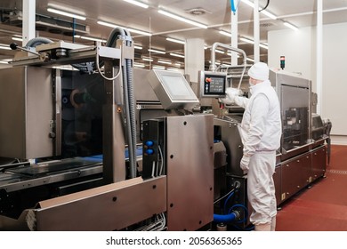 Meat processing plant.Industrial equipment at a meat factory.Modern poultry processing plant.People working at a chicken factory - stock photo.Automated production line in modern food factory. - Powered by Shutterstock