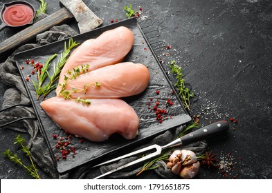 Meat. Raw chicken fillet with spices. Top view. Rustic style.