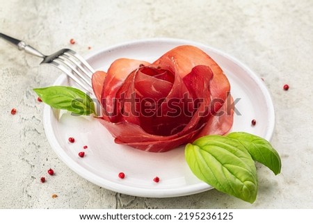 Meat Rose made from Slices of Bresaola, air dried salted italian beef cold cut. Close up.