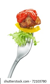 Meat And Salad On A Fork. Isolated