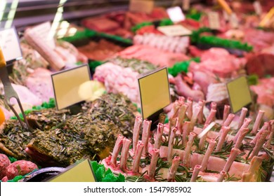 Meat And Sausages In A Butcher Shop. Stand. Showcase With Meat In Small Local Store. UK Food Supermarket.