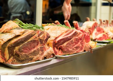 Meat And Sausages In A Butcher Shop. Stand. Showcase With Meat In Small Local Store. UK Food Supermarket.