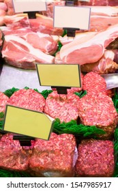 Meat And Sausages In A Butcher Shop. Stand. Showcase With Meat In Small Local Store. UK Food Supermarket.